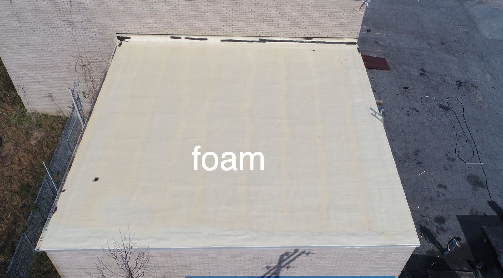 Picture of the foam coat on a roofing project.